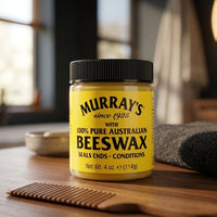 Murrays Beeswax - geel potje op houten blad met kam en handdoek