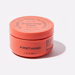 Firsthand Supply Texturizing Paste - set forfra, lukket orange krukke med låg